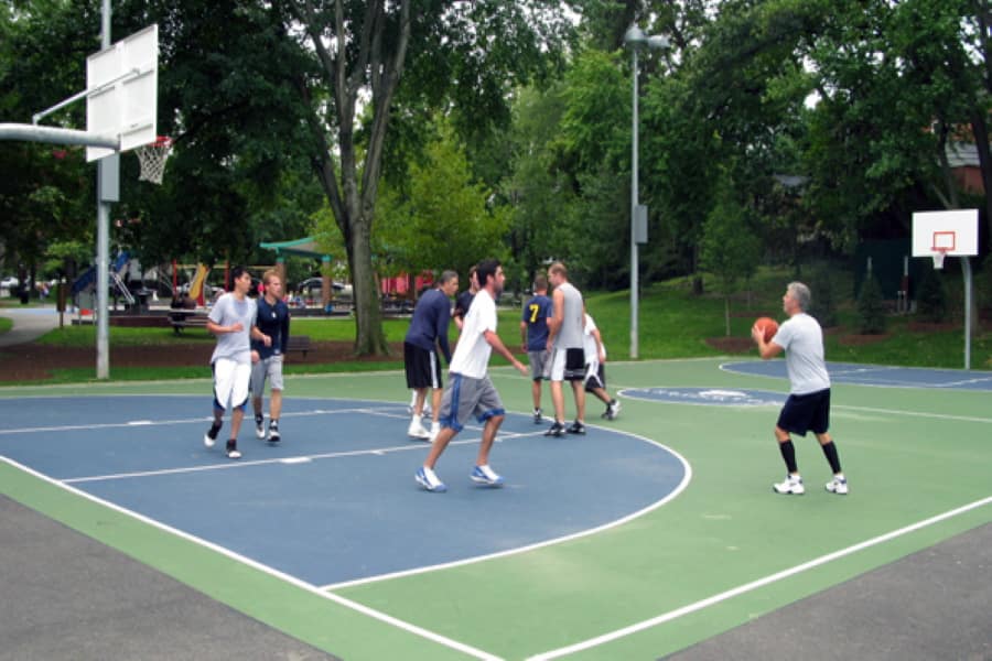 Playing basketball in a park